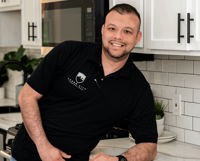 A Charm City Inspections inspector smiling in a kitchen